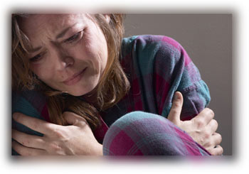 Caucasian Woman hugging herself